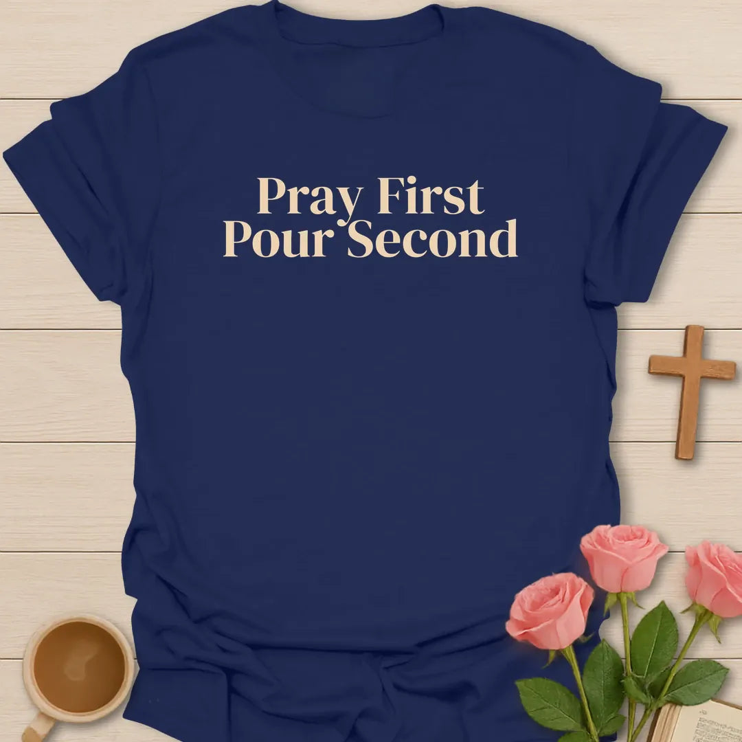 Pray First Pour Second Faith shirt with steaming teacup, cross, and cream vintage lettering. - Navy