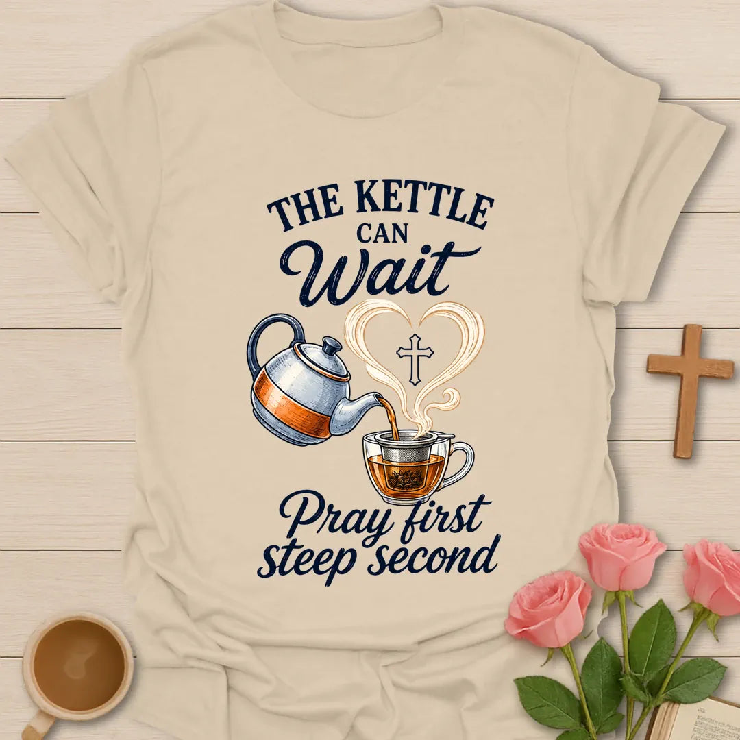 Pray First Steep Second shirt with steaming teacup, cross, and cream vintage lettering. - Sand