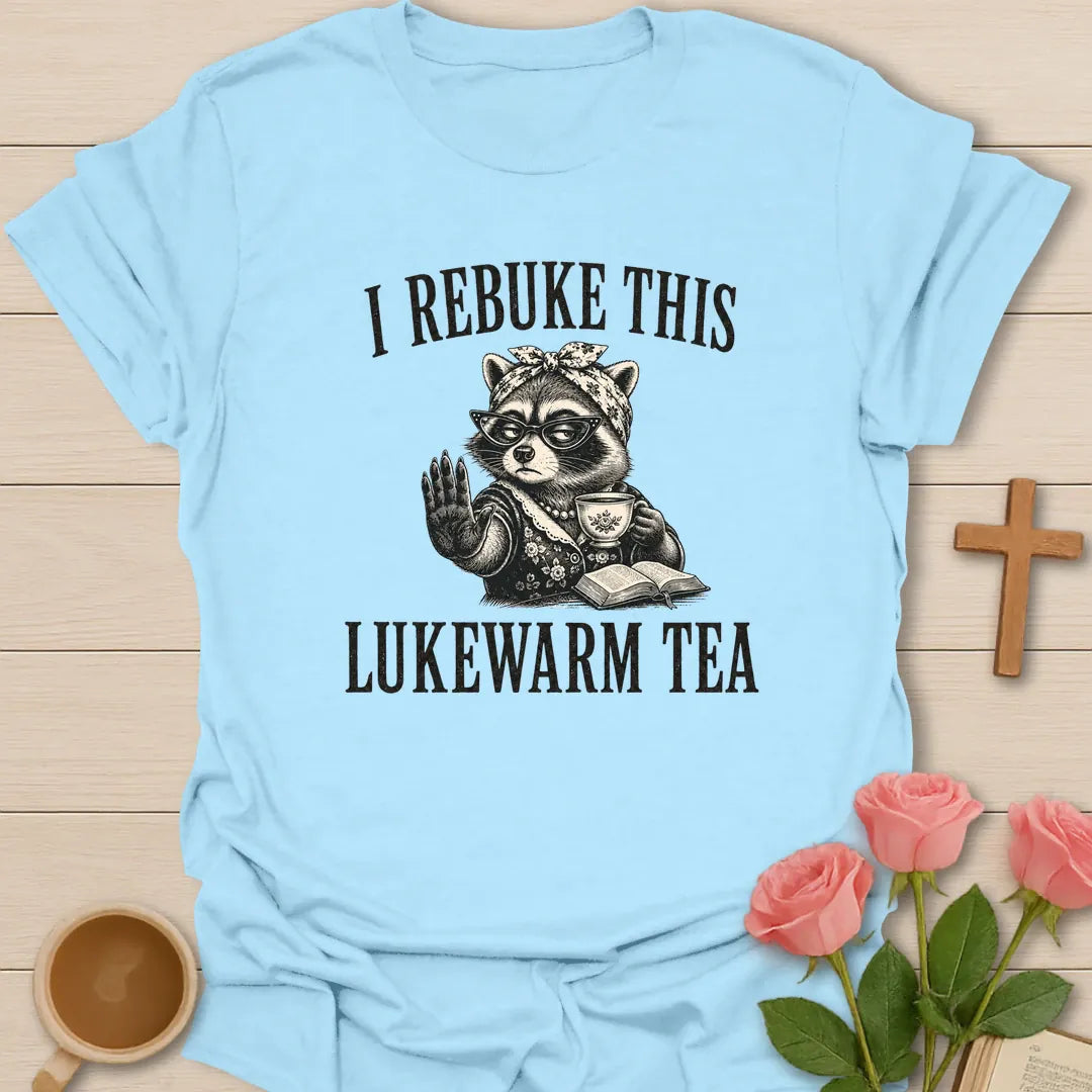Rebuke Lukewarm Tea shirt with teacup, playful lettering, and faith-inspired design. - Light Blue