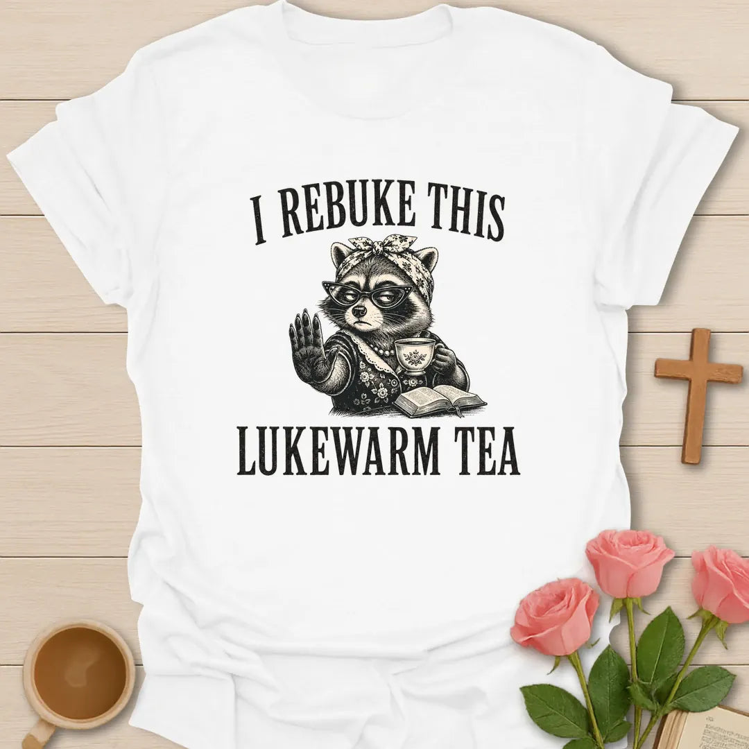 Rebuke Lukewarm Tea shirt with teacup, playful lettering, and faith-inspired design. - White