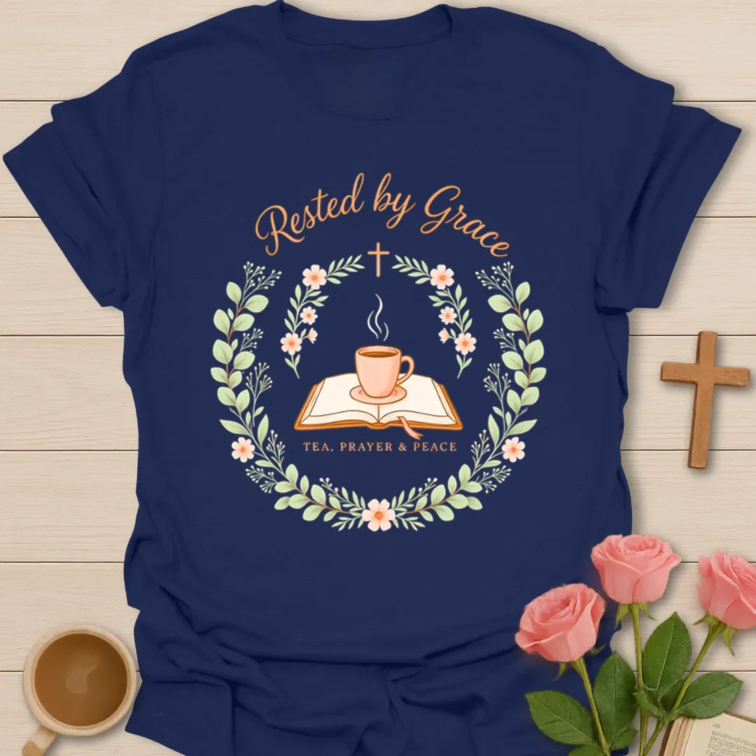 Rested By Grace Christian tea shirt with teacup, open Bible, cross, floral wreath, and Tea Prayer Peace text. - Navy