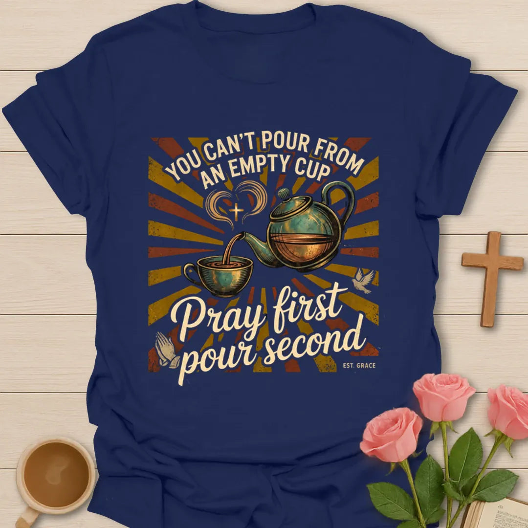 White print Christian tea shirt with You Can’t Pour From An Empty Cup and Pray First Pour Second phrase - Navy