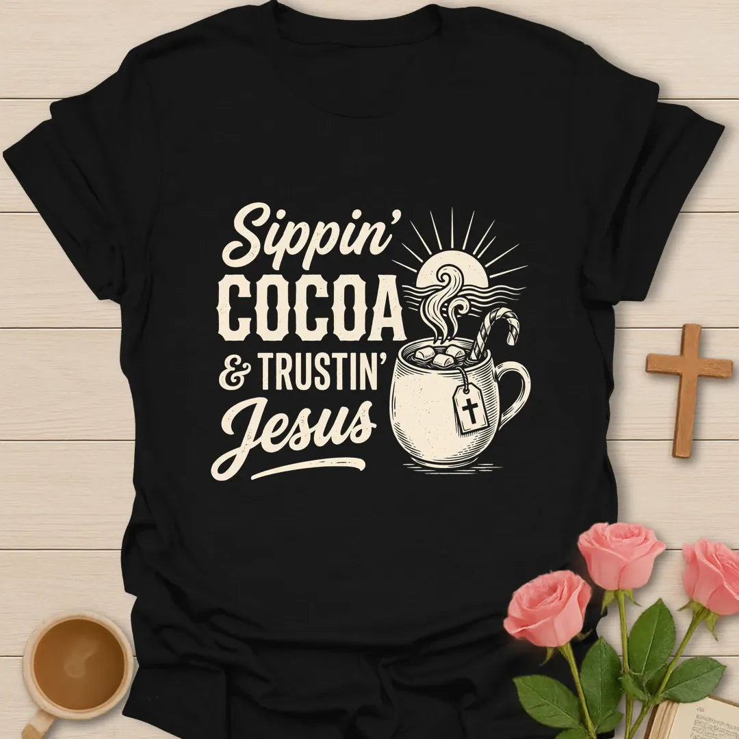 Sippin Cocoa and Trustin Jesus shirt with cocoa mug, cross, and cream vintage lettering. - Black