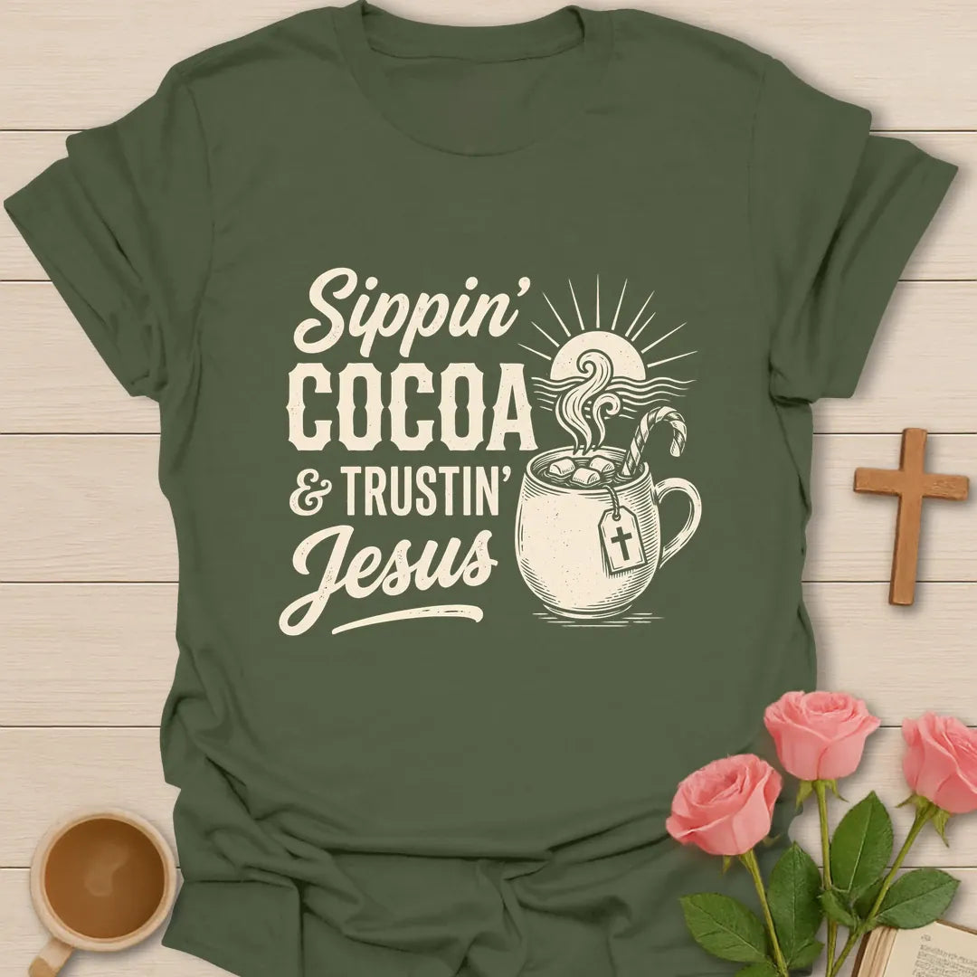 Sippin Cocoa and Trustin Jesus shirt with cocoa mug, cross, and cream vintage lettering. - Military Green