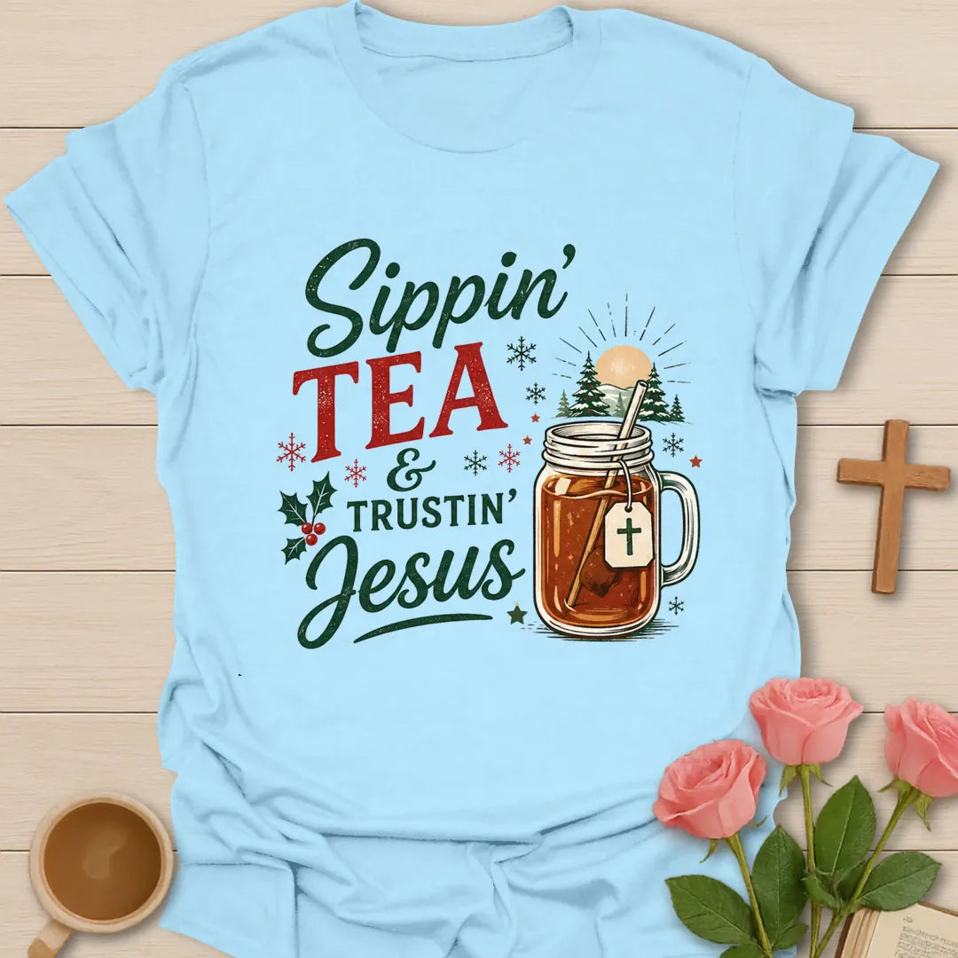 Sippin Tea and Trustin Jesus Christmas Christian T-shirt with tea mason jar cross and snowy trees - Light Blue