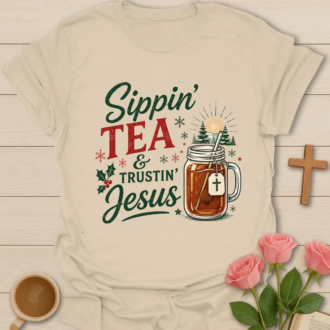 Sippin Tea and Trustin Jesus Christmas Christian T-shirt with tea mason jar cross and snowy trees - Sand