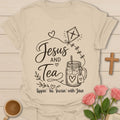 Jesus and Tea shirt with mason jar iced tea, kite with cross, hearts, leaves, and Sippin Tea Soarin With Jesus text. - Sand