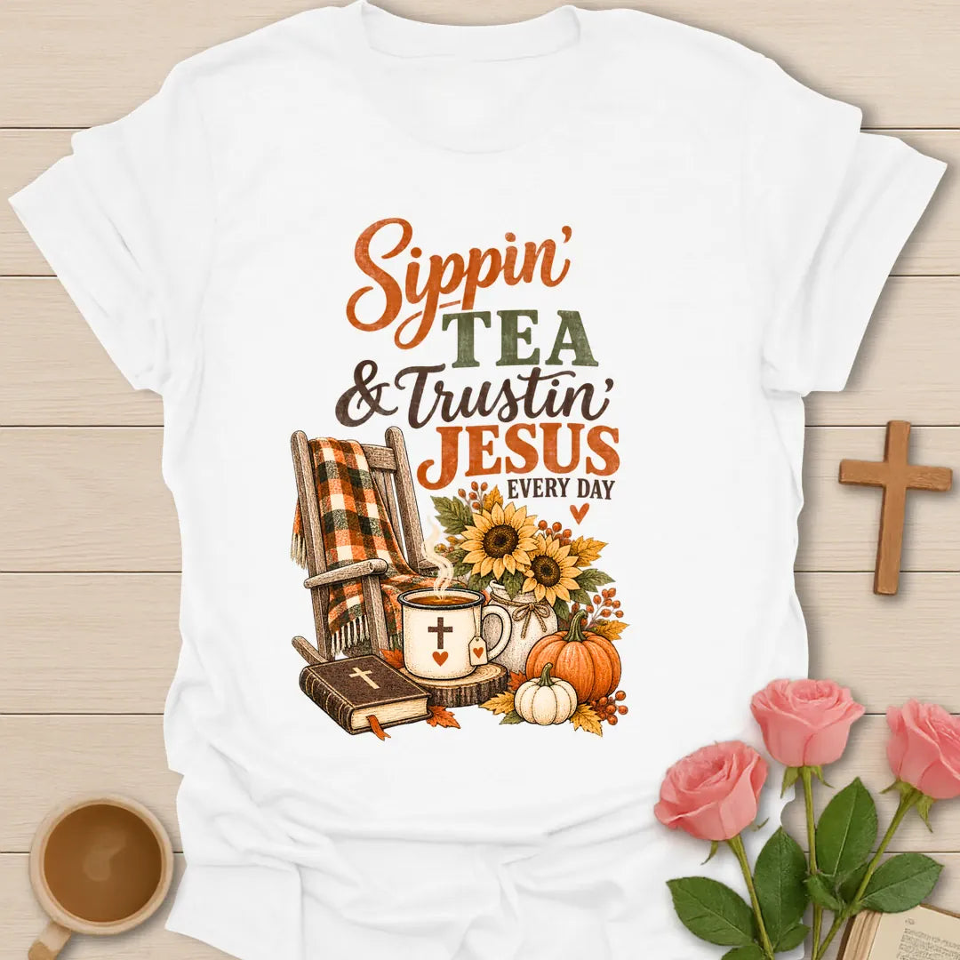 Sippin and Trustin shirt with cozy lettering and a faith-inspired fall tea design. - White