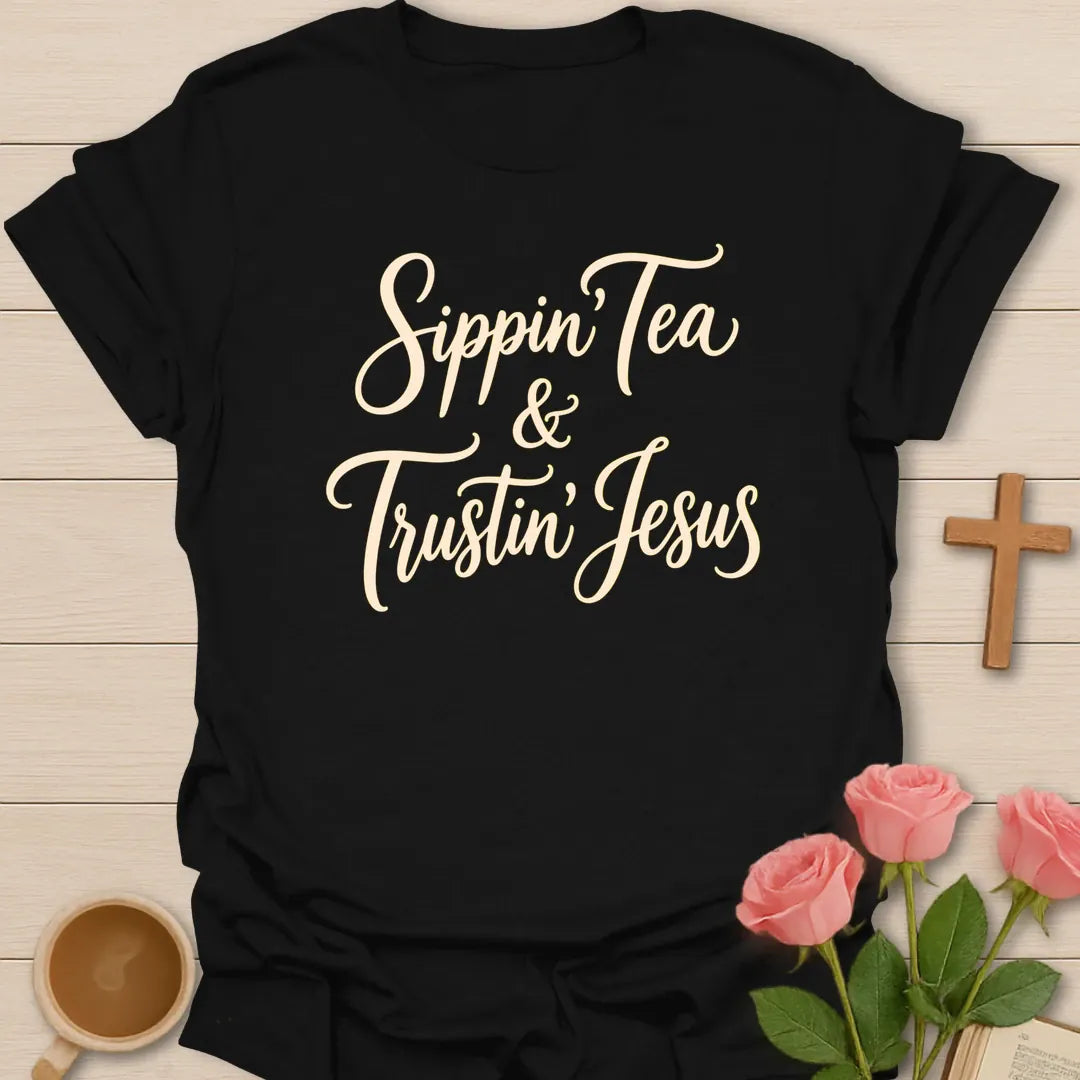 Sippin and Trustin Jesus shirt with teacup, cross, and cream vintage lettering. - Black