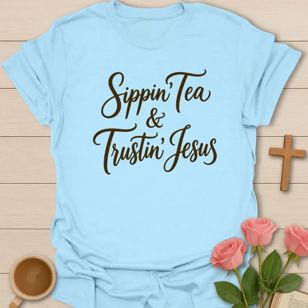 Sippin and Trustin Jesus shirt with teacup, cross, and cream vintage lettering. - Light Blue
