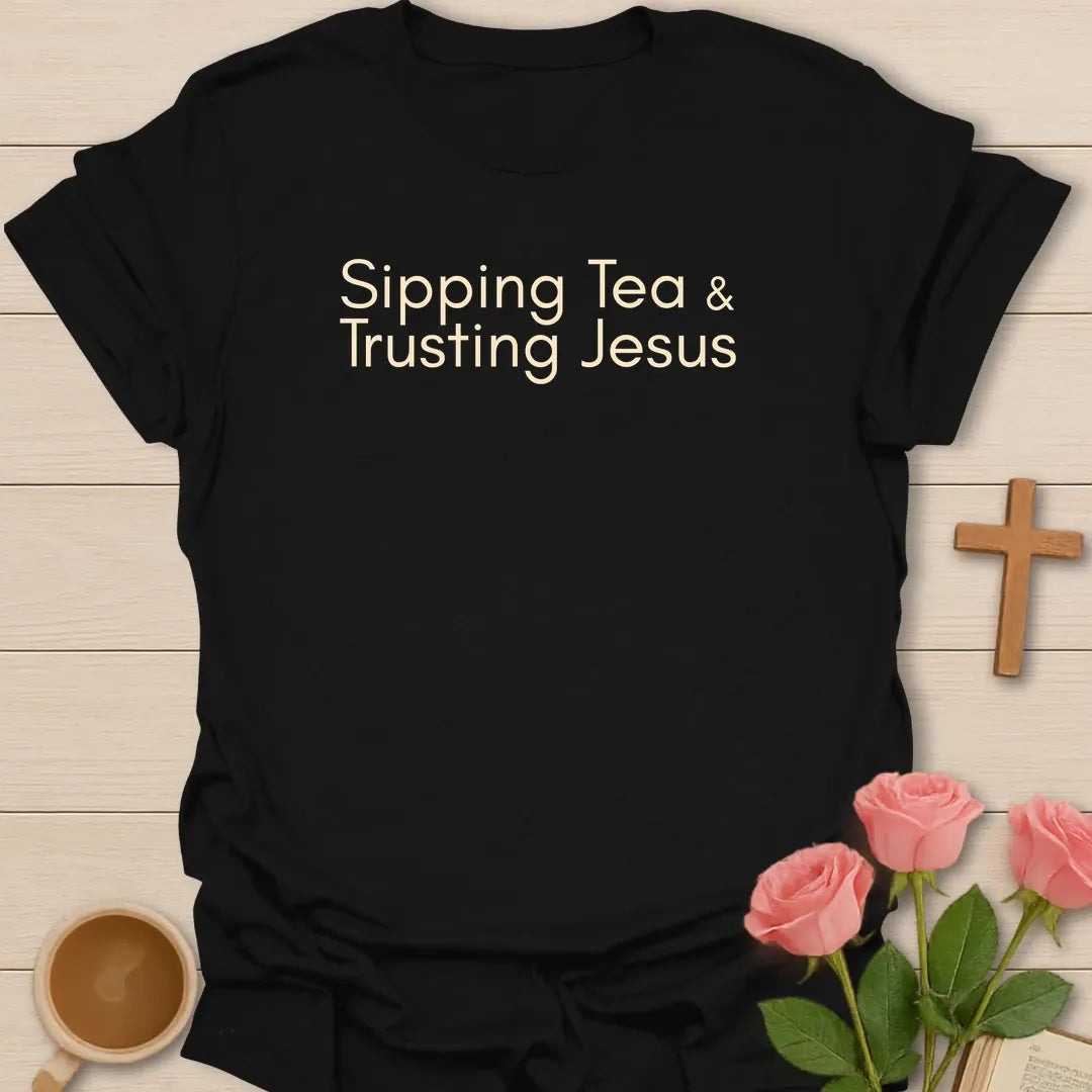 Sipping Tea and Trusting Jesus shirt with minimal cream typography on black background style. - Black
