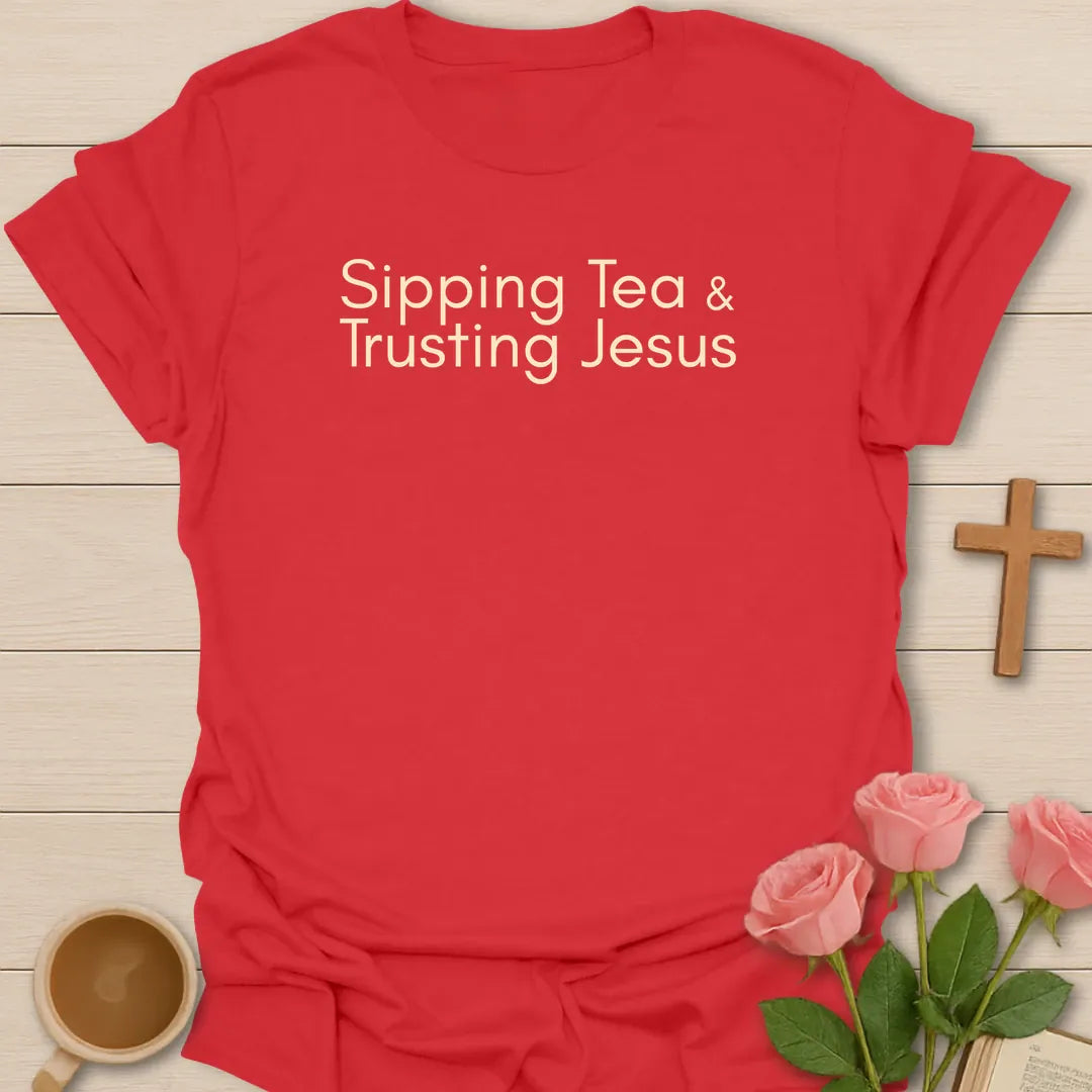 Sipping Tea and Trusting Jesus shirt with minimal cream typography on black background style. - Red