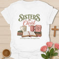 Sisters In Christ t-shirt with friendship lettering and faith-inspired design - White