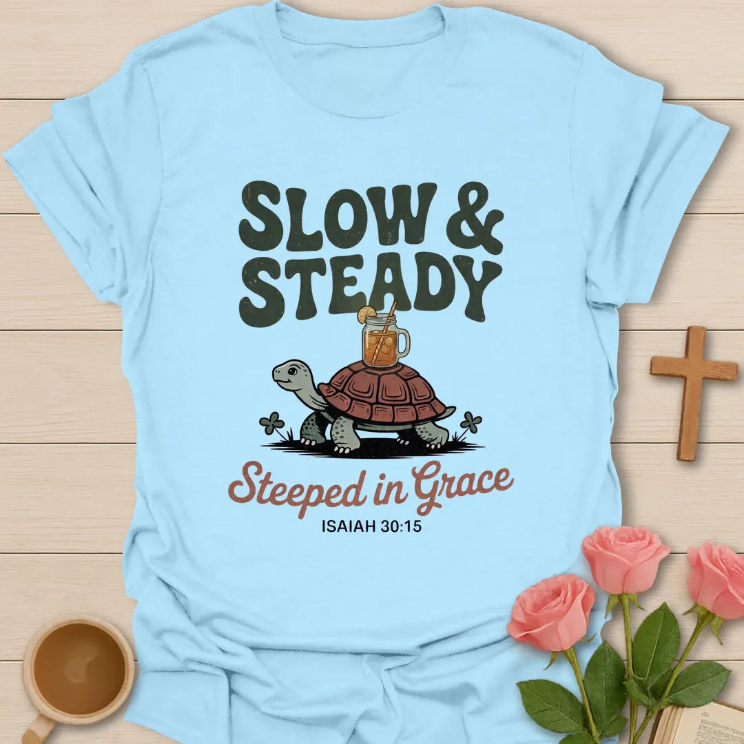 Slow & Steady Steeped in Grace Christian t-shirt with a smiling tortoise carrying a mason jar of iced tea and Isaiah 30:15 - Light Blue
