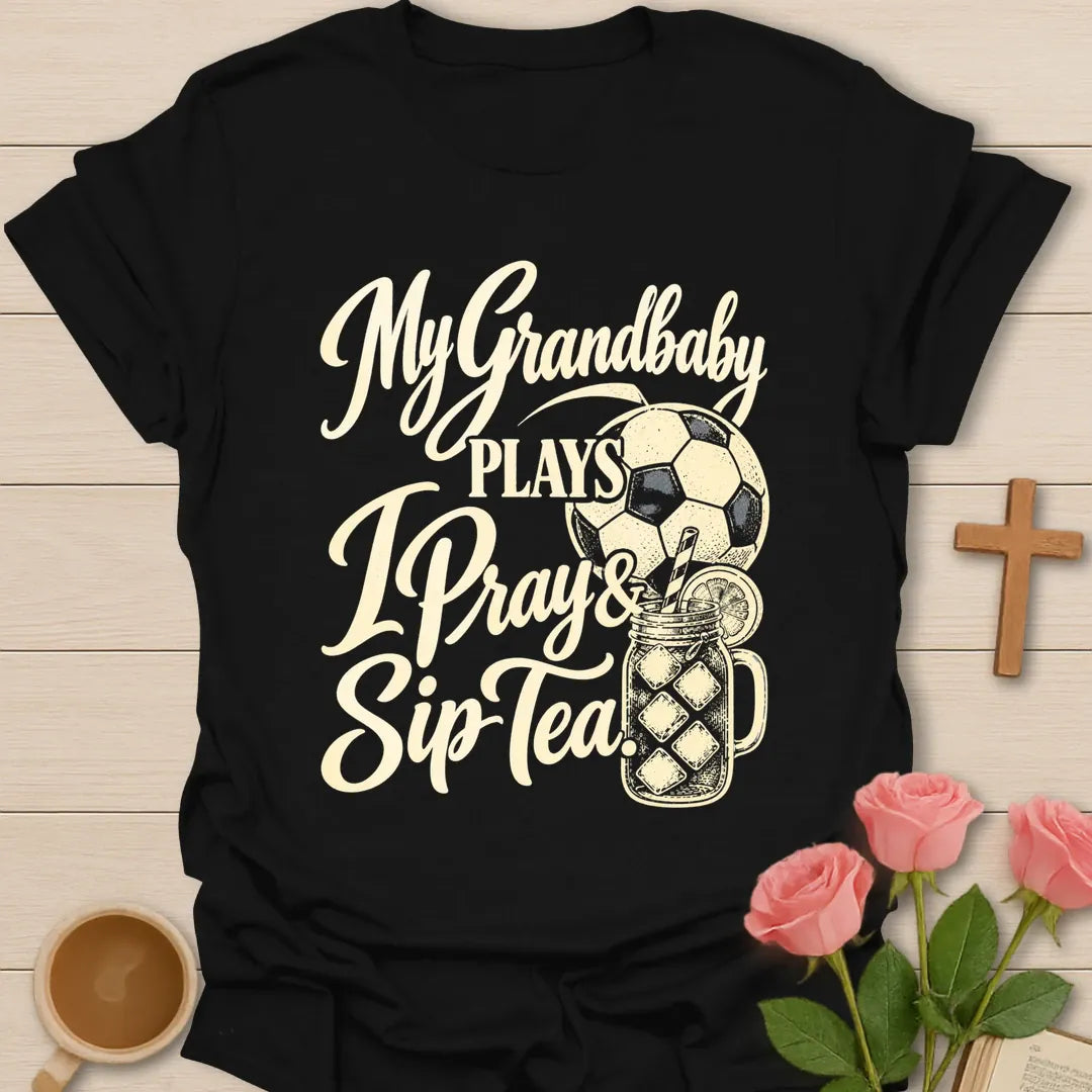 My Grandbaby Plays, I Pray & Sip Tea t-shirt with script lettering, a soccer ball and an iced tea mason jar - Black