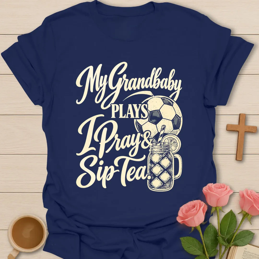 My Grandbaby Plays, I Pray & Sip Tea t-shirt with script lettering, a soccer ball and an iced tea mason jar - Navy