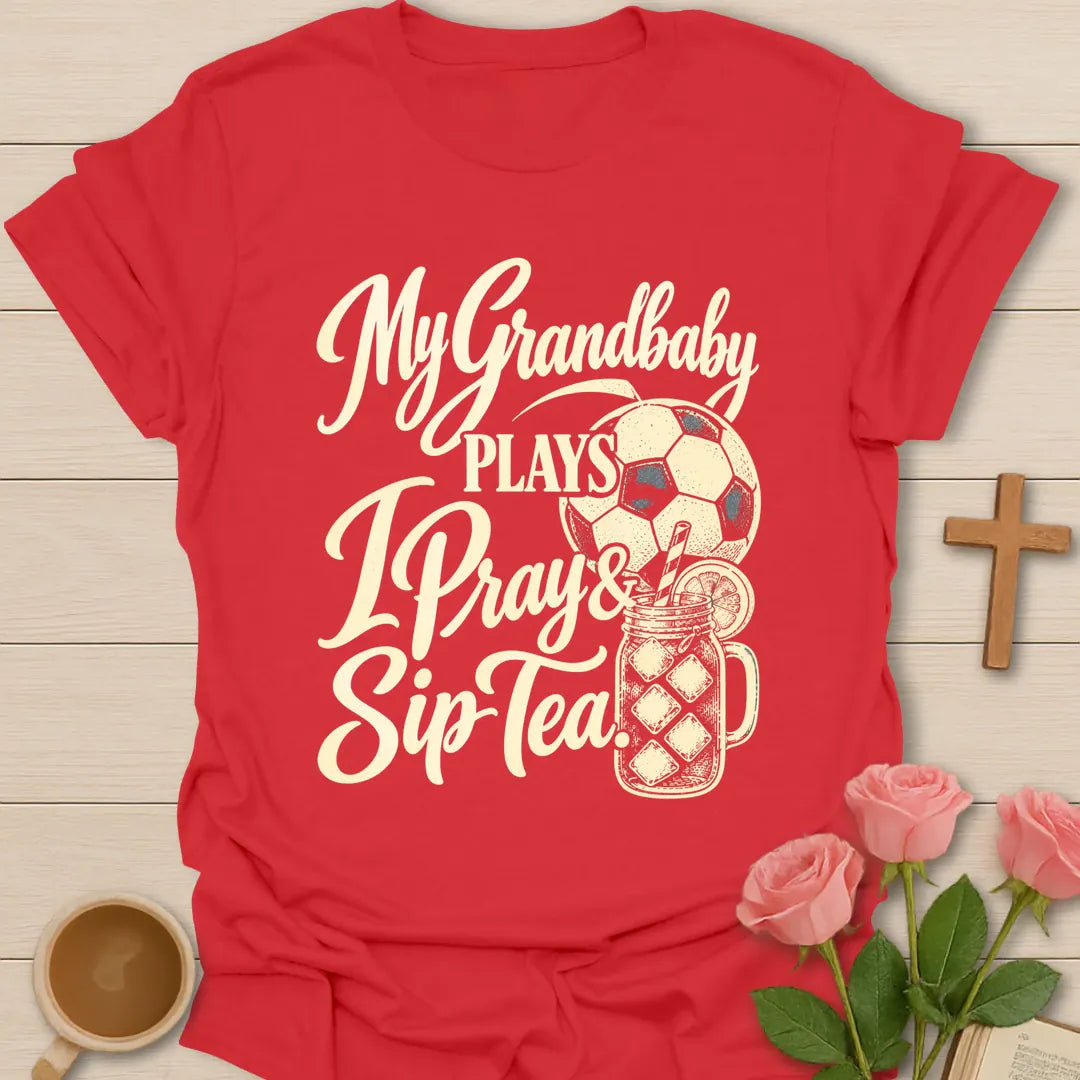 My Grandbaby Plays, I Pray & Sip Tea t-shirt with script lettering, a soccer ball and an iced tea mason jar - Red
