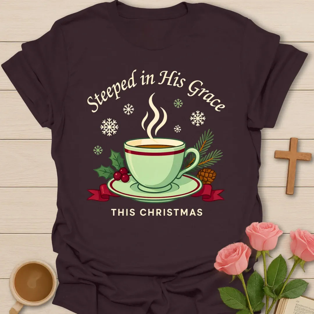 Steeped in His Grace Christmas shirt with green teacup, holly, pine, snowflakes, and cream lettering. - Dark Chocolate