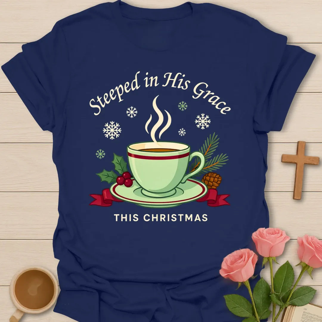Steeped in His Grace Christmas shirt with green teacup, holly, pine, snowflakes, and cream lettering. - Navy