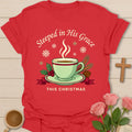 Steeped in His Grace Christmas shirt with green teacup, holly, pine, snowflakes, and cream lettering. - Red
