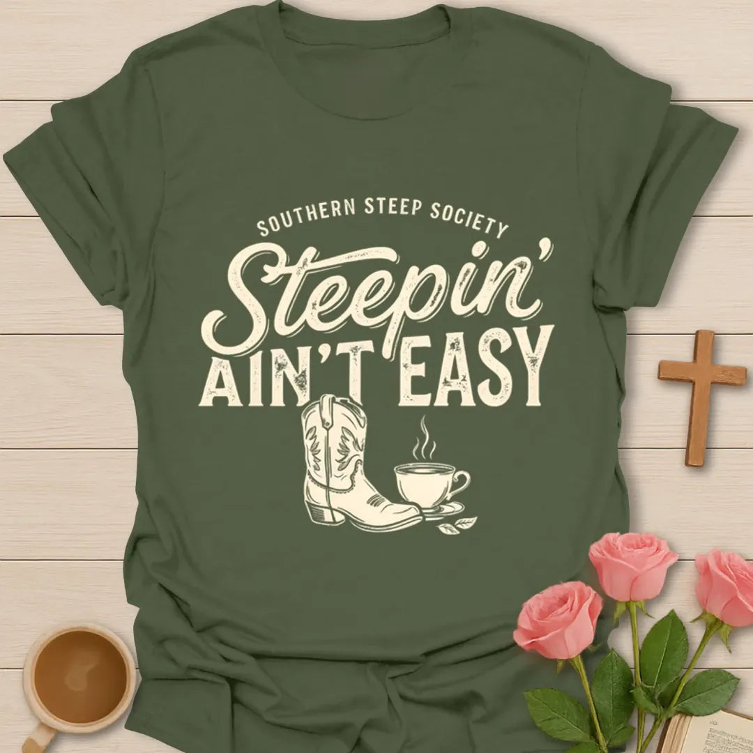 Steepin Ain’t Easy cowgirl tea shirt with Western boot, steaming teacup, and Southern Steep Society text - Military Green