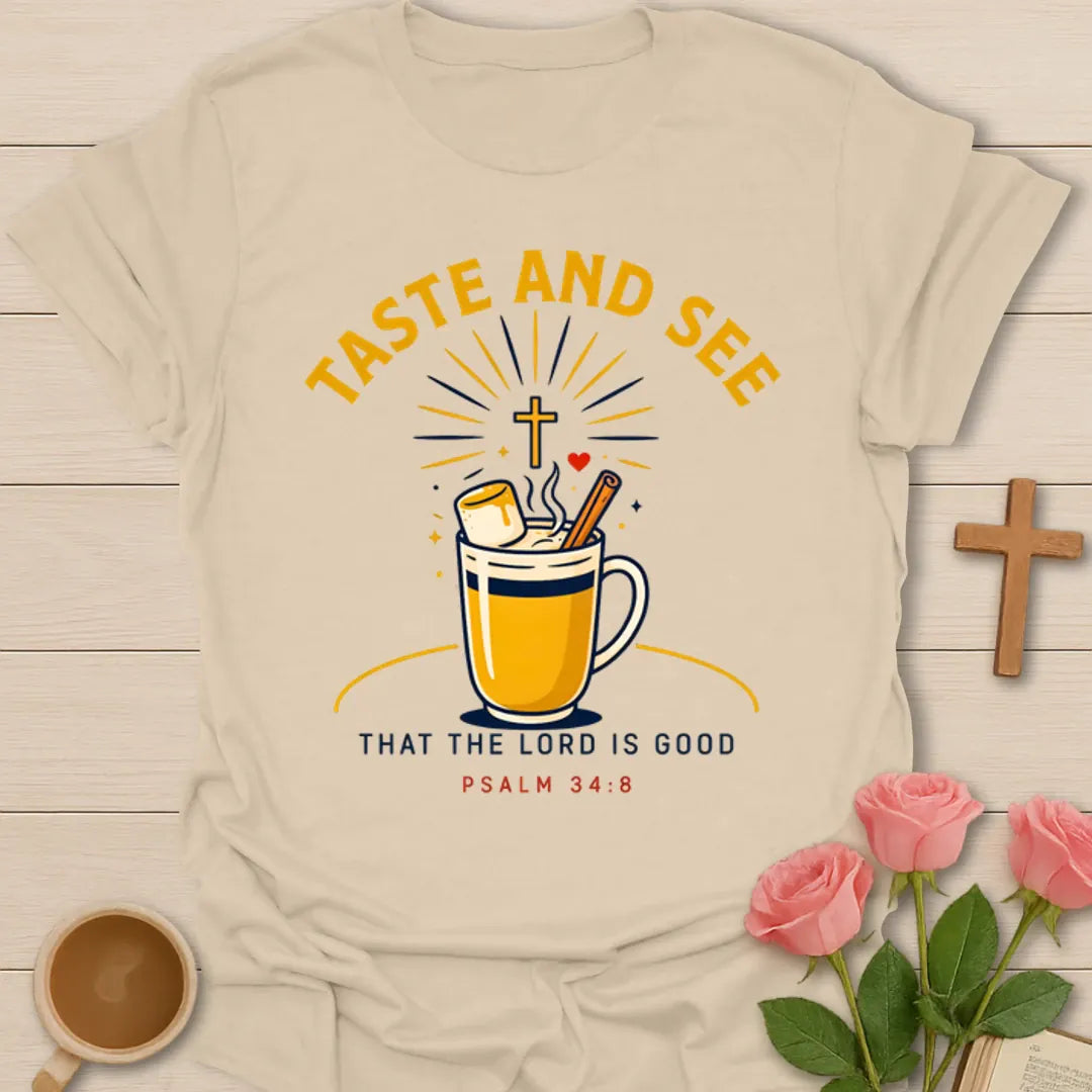 Taste And See tea shirt with steaming mug, marshmallow, cinnamon stick, cross, and sunburst. - Sand