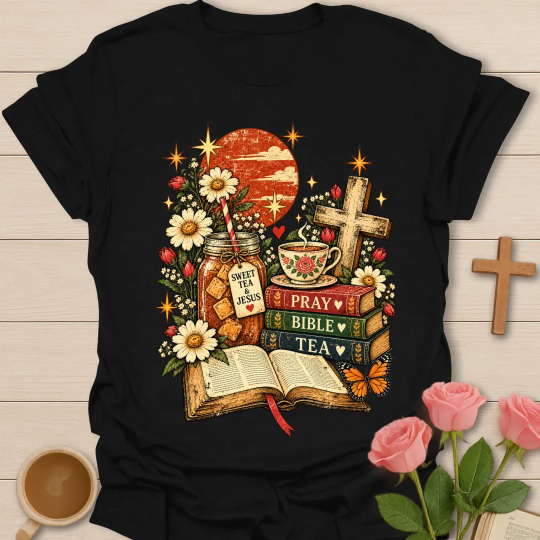Tea Bible & Blooms t-shirt with an open Bible, a Pray Bible Tea book stack, a Sweet Tea & Jesus jar, a teacup, a wooden cross, daisies and a butterfly - Black