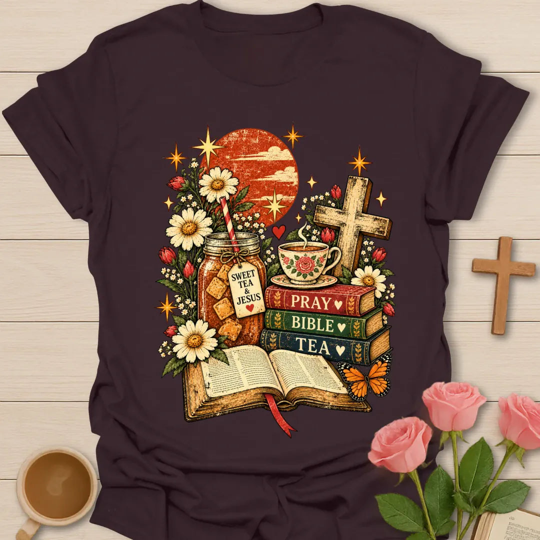 Tea Bible & Blooms t-shirt with an open Bible, a Pray Bible Tea book stack, a Sweet Tea & Jesus jar, a teacup, a wooden cross, daisies and a butterfly - Dark Chocolate