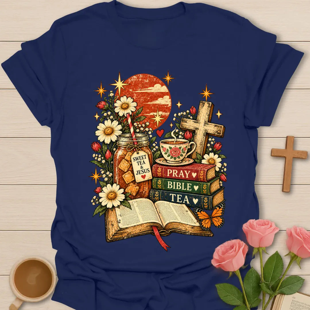 Tea Bible & Blooms t-shirt with an open Bible, a Pray Bible Tea book stack, a Sweet Tea & Jesus jar, a teacup, a wooden cross, daisies and a butterfly - Navy