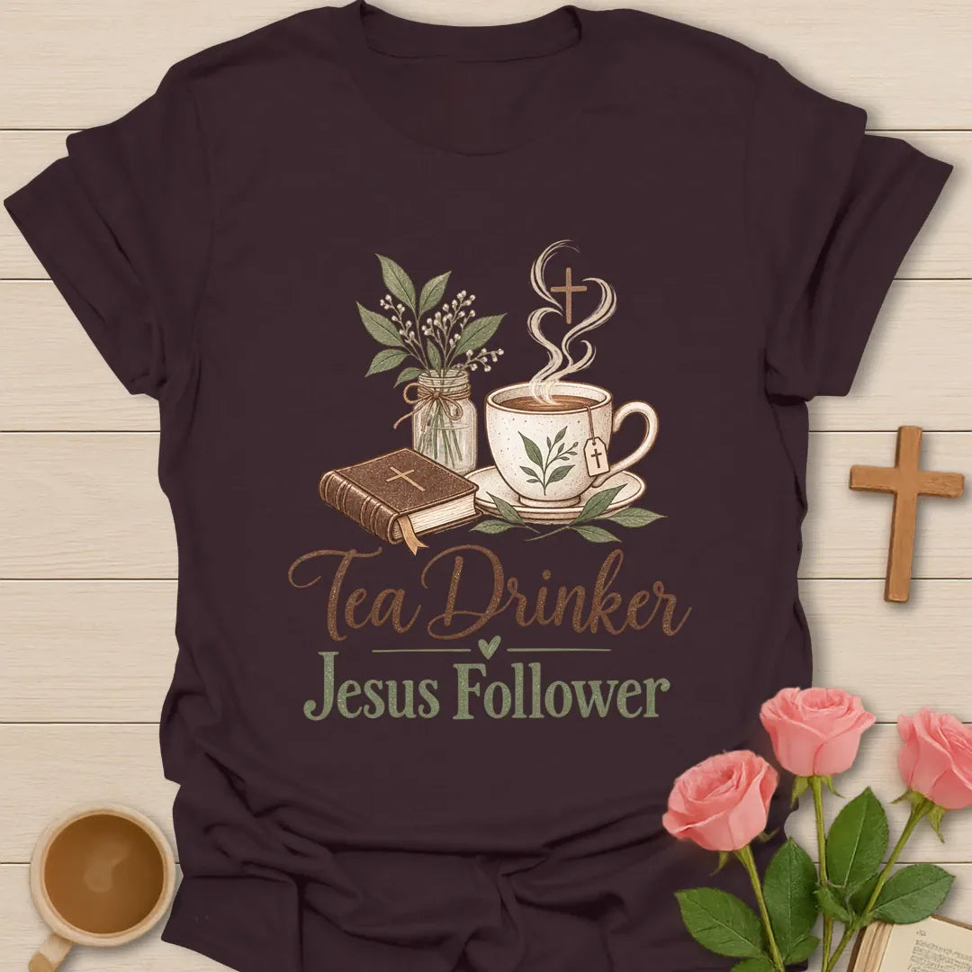 Tea Drinker Jesus Follower t-shirt with script lettering, a Bible, a teacup with cross-shaped steam and a jar of greenery. - Dark Chocolate