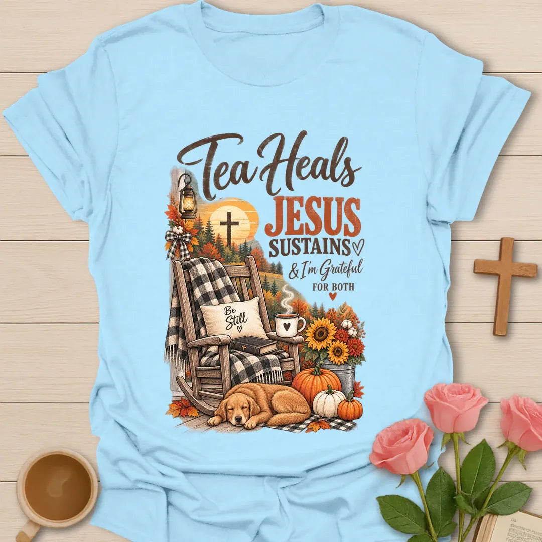 Tea Heals Jesus Sustains shirt with gentle lettering and a faith-inspired tea design. - Light Blue