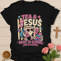Tea and Jesus back to school shirt with smiling teacup, backpack, books, apple, sunglasses, and Philippians 4:13 text. - Black