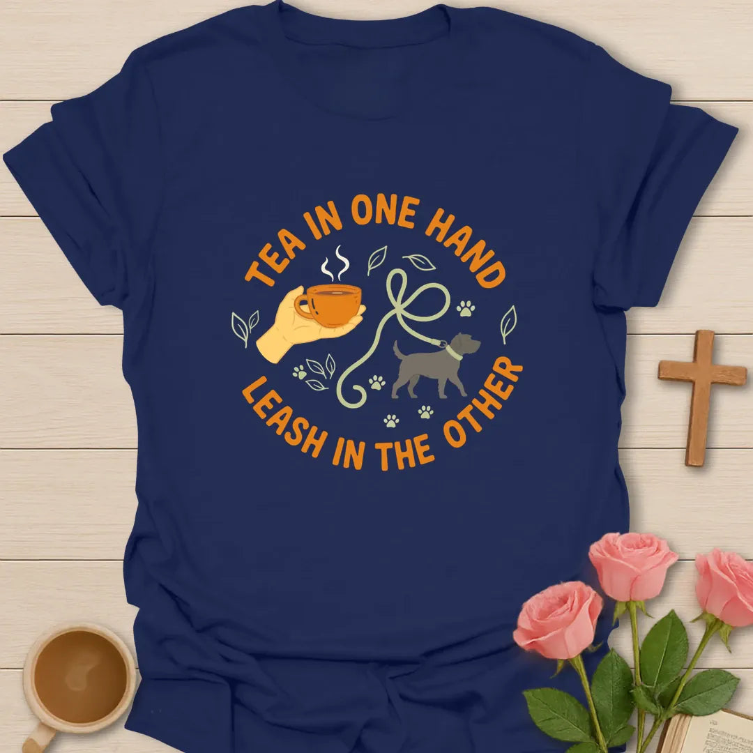 Tea in One Hand Leash in the Other Christian t-shirt with a hand holding a teacup, a dog on a leash and paw prints in a circle - Navy