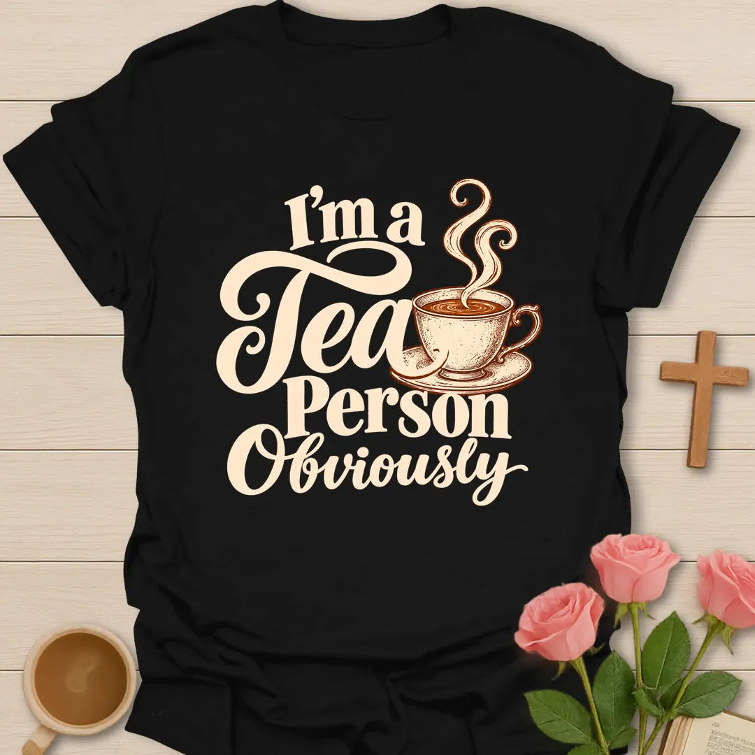 I'm a Tea Person Obviously Christian t-shirt with cream script lettering and a steaming teacup - Black