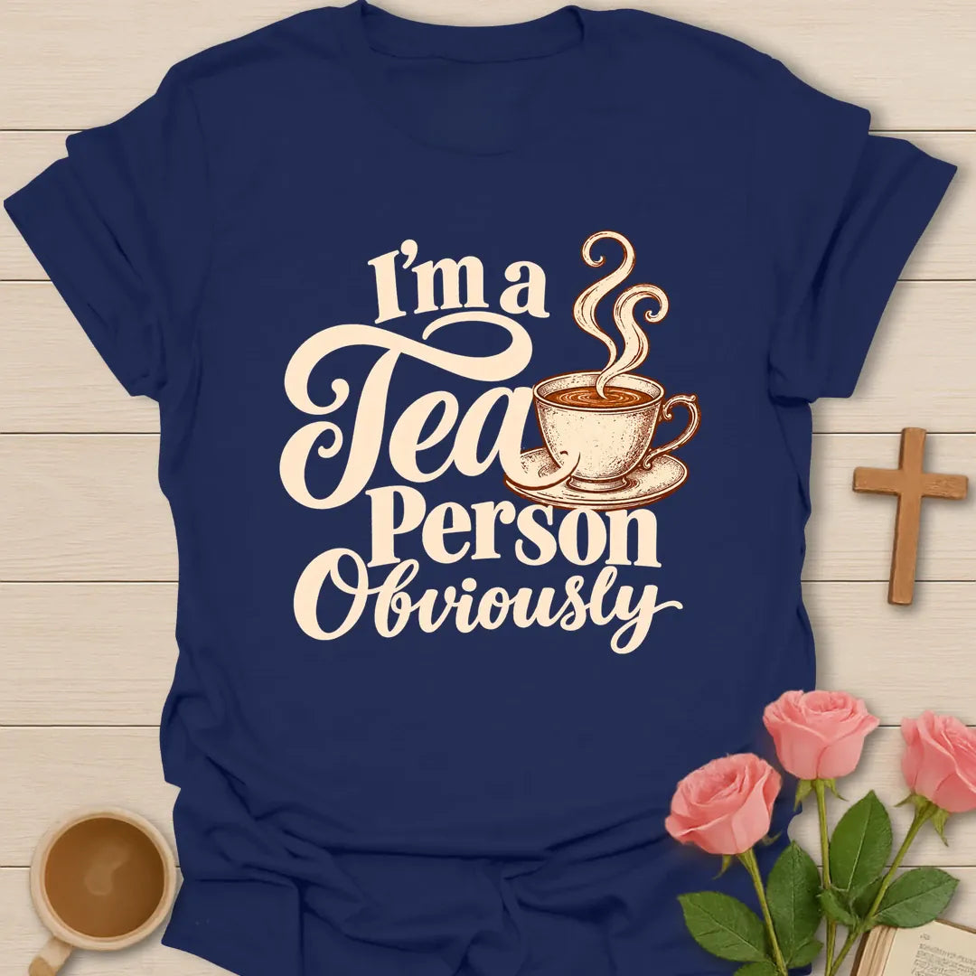I'm a Tea Person Obviously Christian t-shirt with cream script lettering and a steaming teacup - Navy