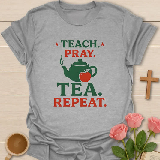 Teach Pray Tea Repeat shirt with stacked red and green lettering, green teapot silhouette, red apple, stars, and vintage distressed texture. - Sport Grey