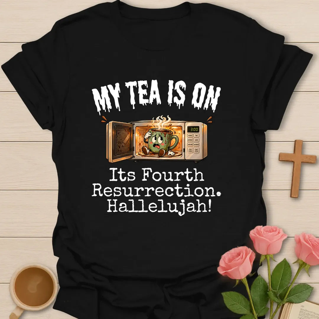 My Tea Is On Its Fourth Resurrection, Hallelujah funny Christian t-shirt with a cartoon mug glowing inside a microwave - Black