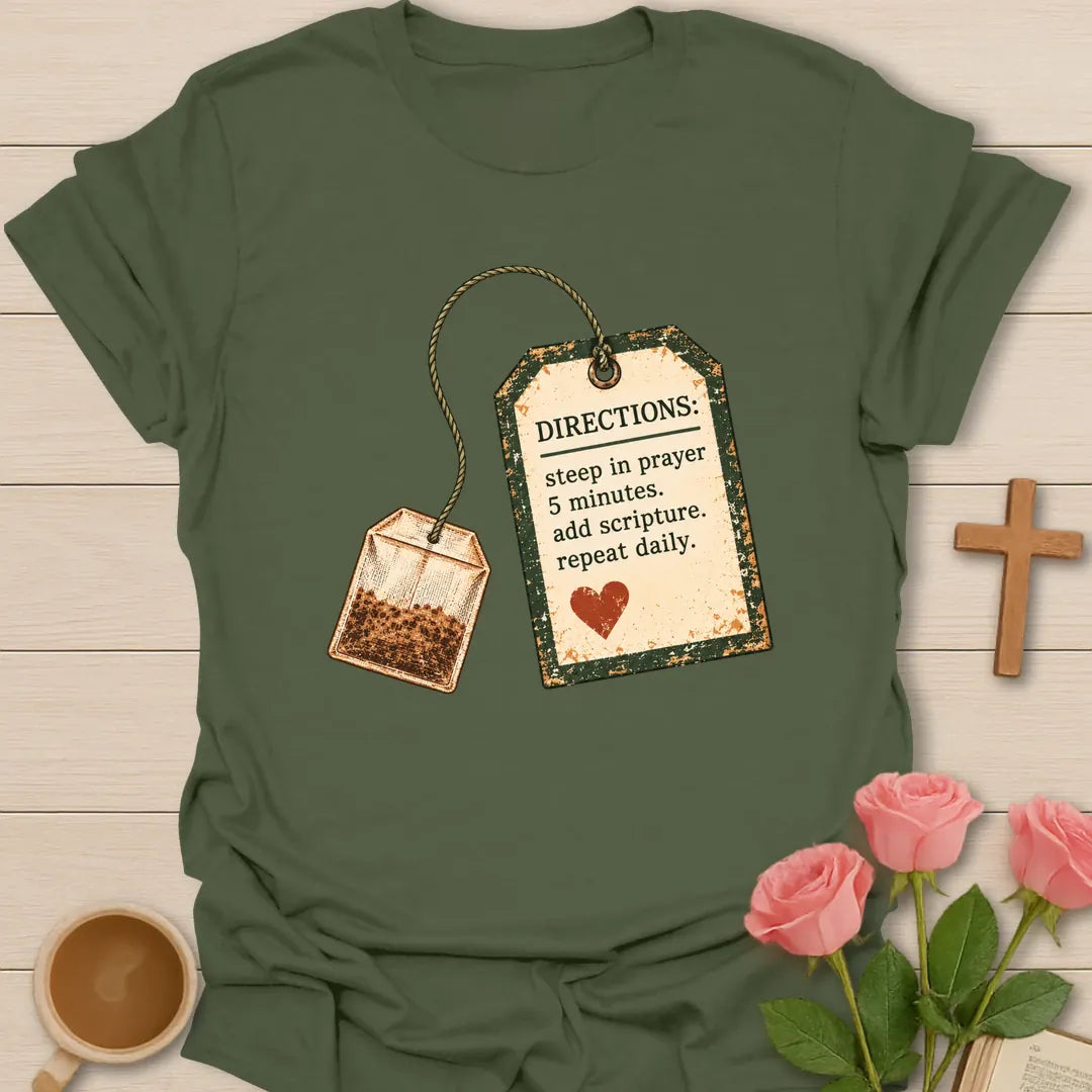 Christian t-shirt with a vintage tea bag and tag reading Directions: steep in prayer 5 minutes, add scripture, repeat daily - Military Green