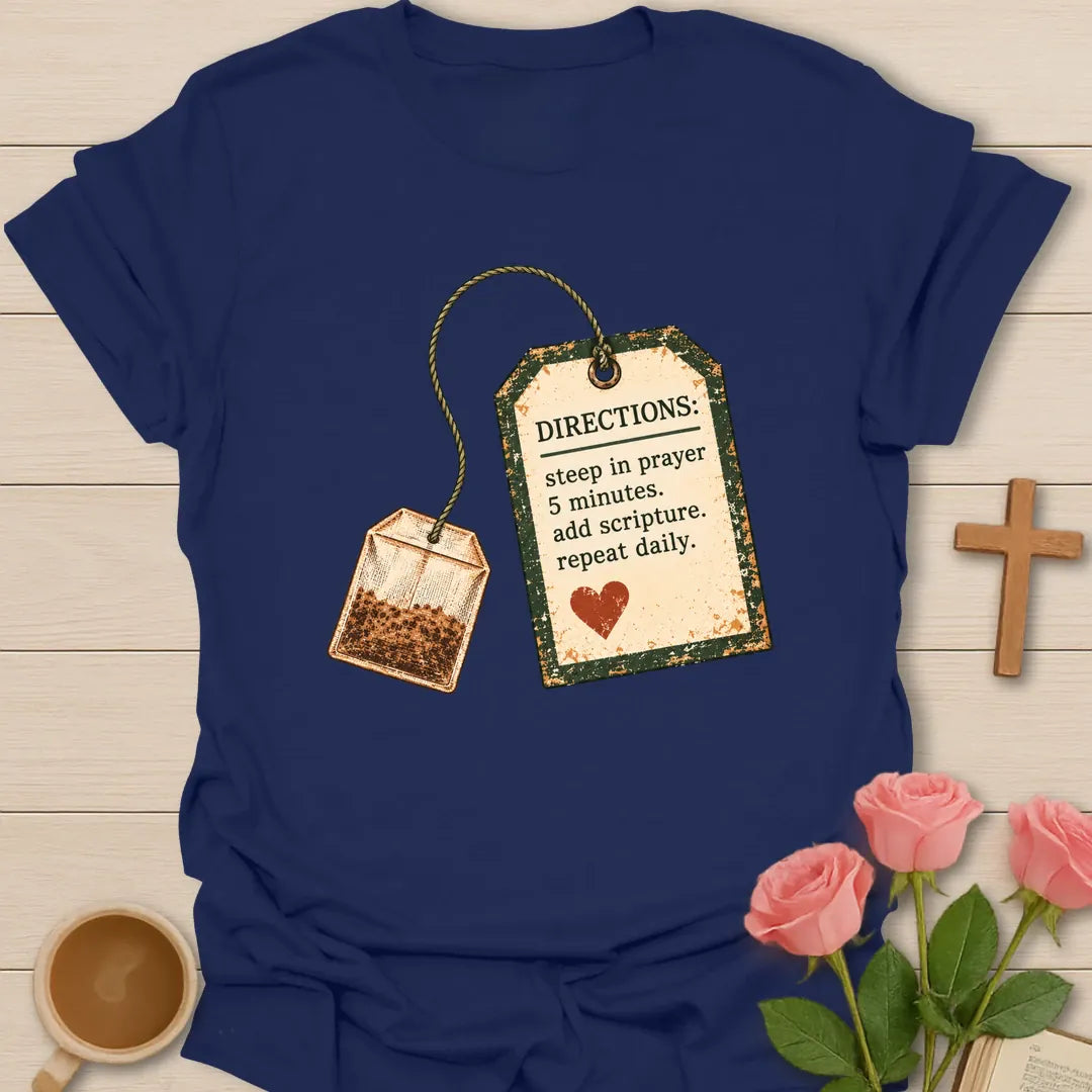 Christian t-shirt with a vintage tea bag and tag reading Directions: steep in prayer 5 minutes, add scripture, repeat daily - Navy