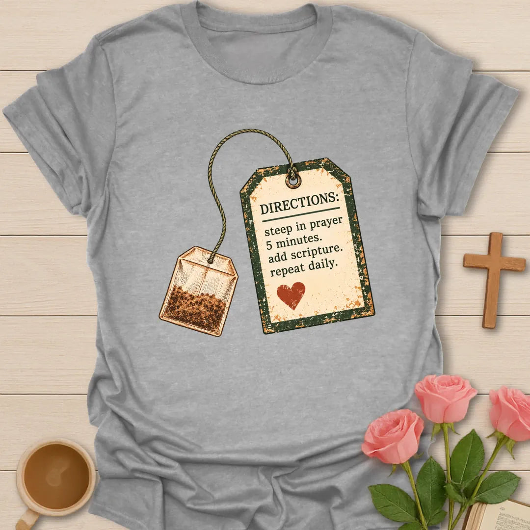 Christian t-shirt with a vintage tea bag and tag reading Directions: steep in prayer 5 minutes, add scripture, repeat daily - Sport Grey