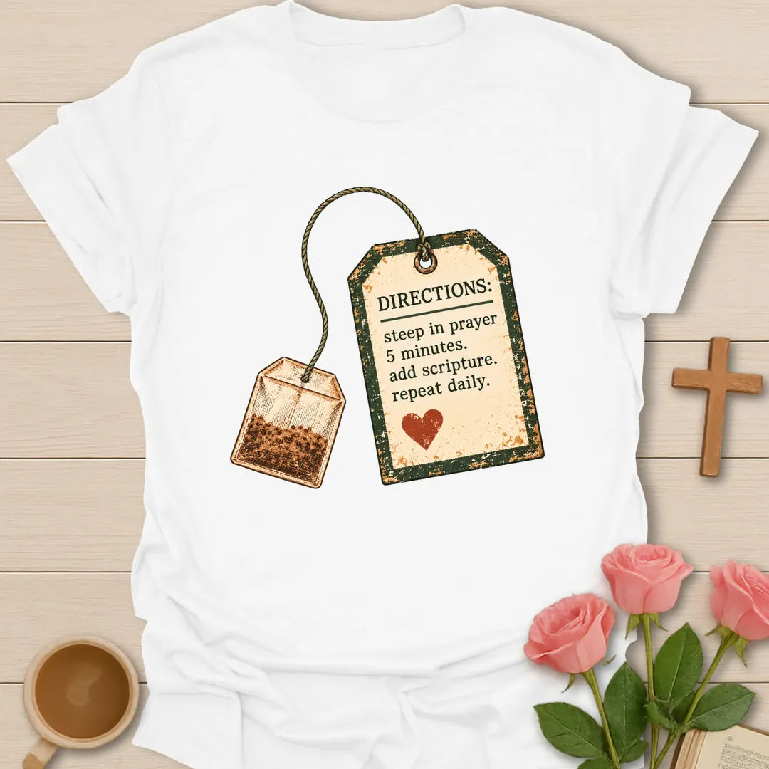 Christian t-shirt with a vintage tea bag and tag reading Directions: steep in prayer 5 minutes, add scripture, repeat daily - White