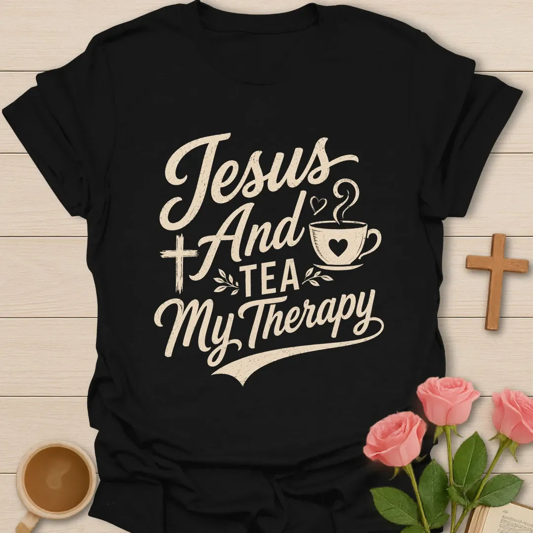 Jesus and Tea My Therapy shirt with bold cream lettering, teacup, cross, heart steam, and leafy accents. - Black
