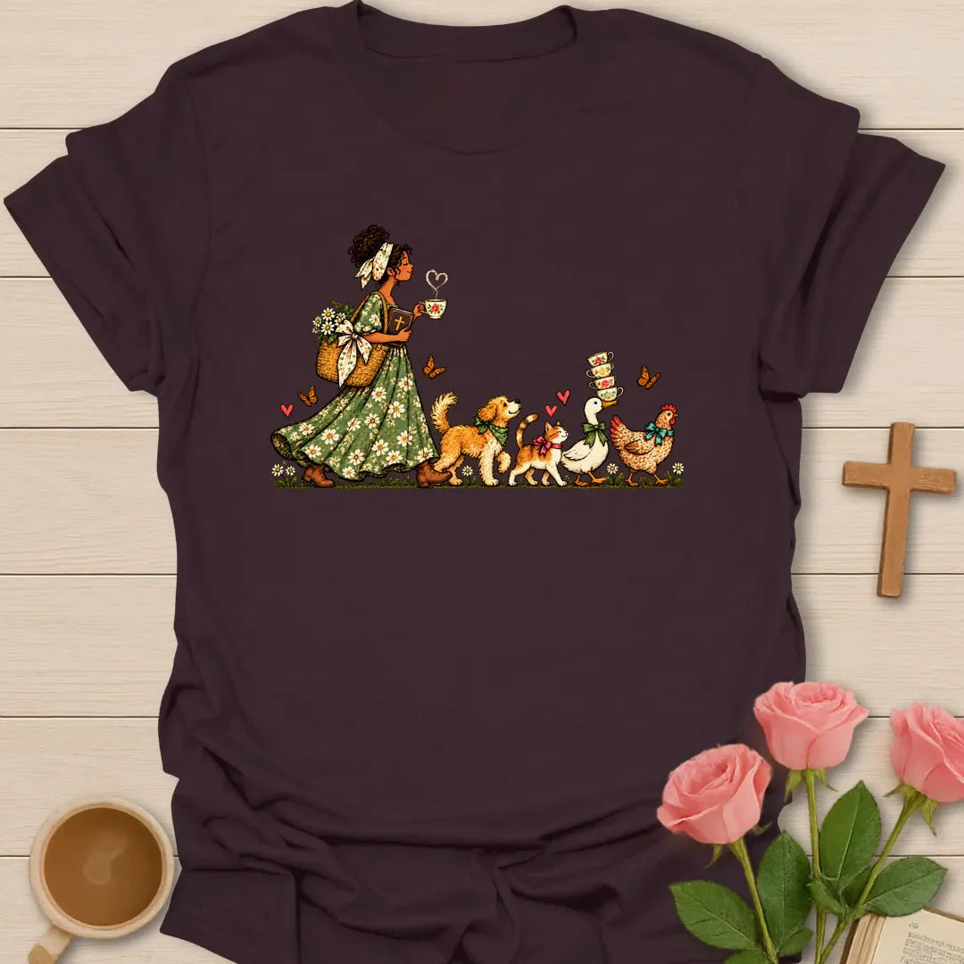 Tea-Time Parade t-shirt with a woman in a floral dress holding a teacup, followed by a dog, a cat, a goose and a chicken carrying teacups - Dark Chocolate