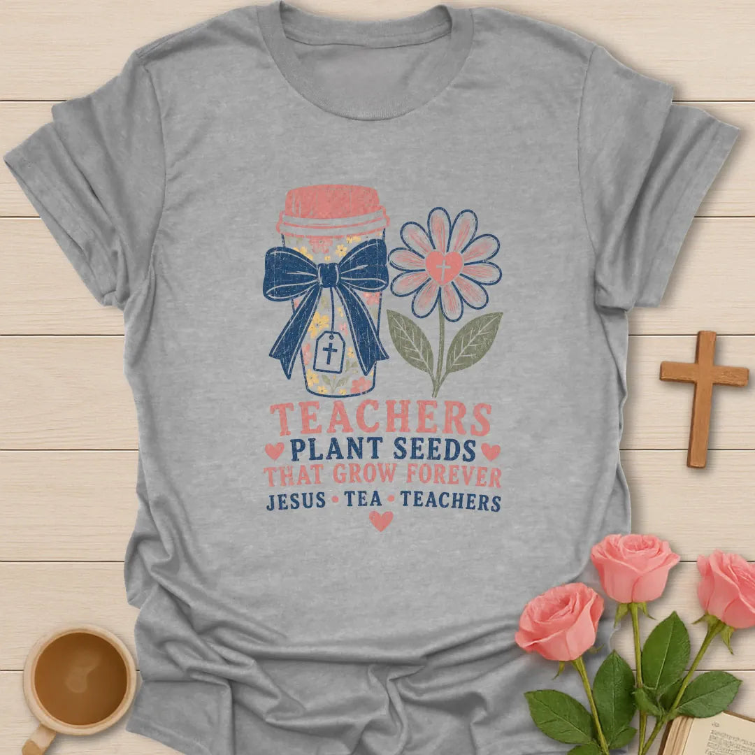Teachers Plant Seeds shirt with floral pencil jar, navy bow, pink flower with cross, stacked text, hearts, and Jesus Tea Teachers phrase. - Sport Grey