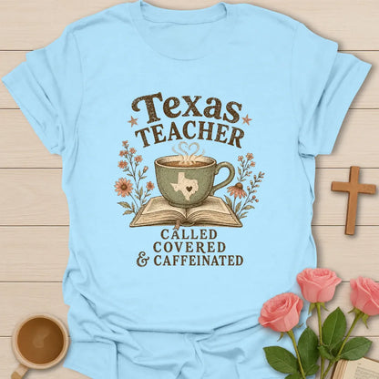 Texas Teacher shirt with sage teacup on open Bible, Texas silhouette, wildflowers, distressed brown lettering, and vintage boutique colors. - Light Blue