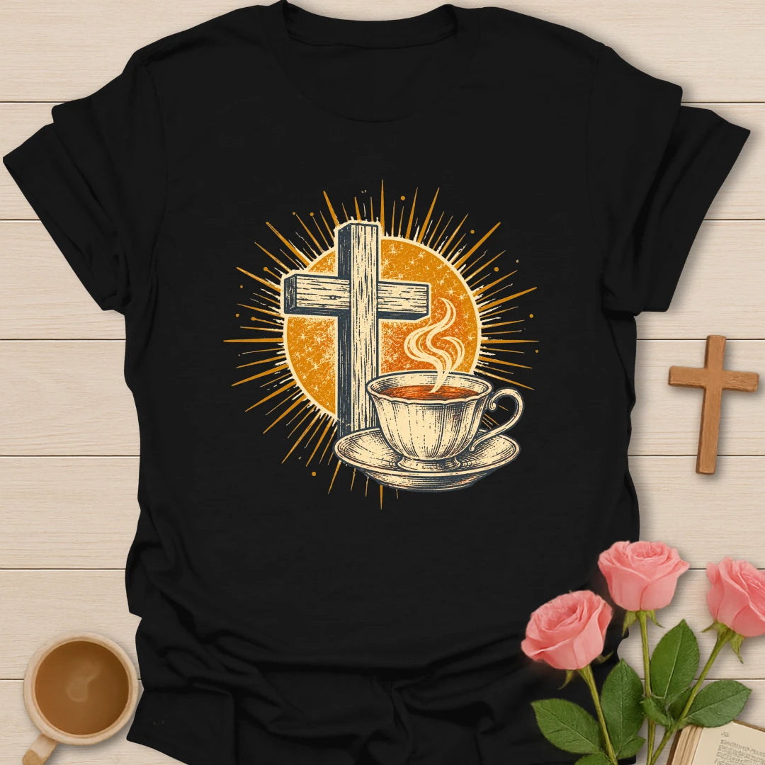 Vintage Tea Cross Sunburst t-shirt with a rustic wooden cross and a steaming teacup on a saucer inside a golden sunburst - Black