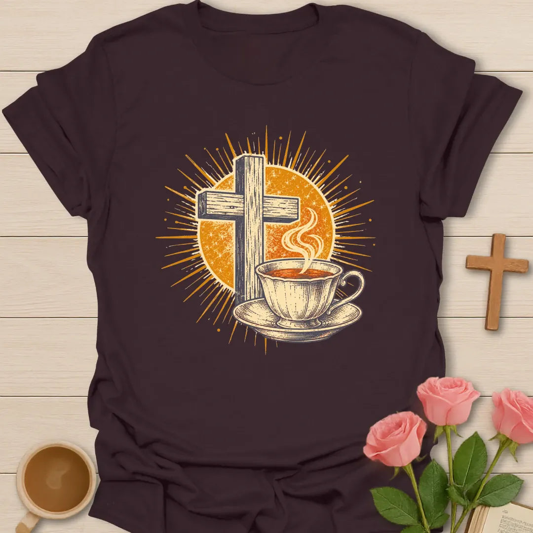 Vintage Tea Cross Sunburst t-shirt with a rustic wooden cross and a steaming teacup on a saucer inside a golden sunburst - Dark Chocolate