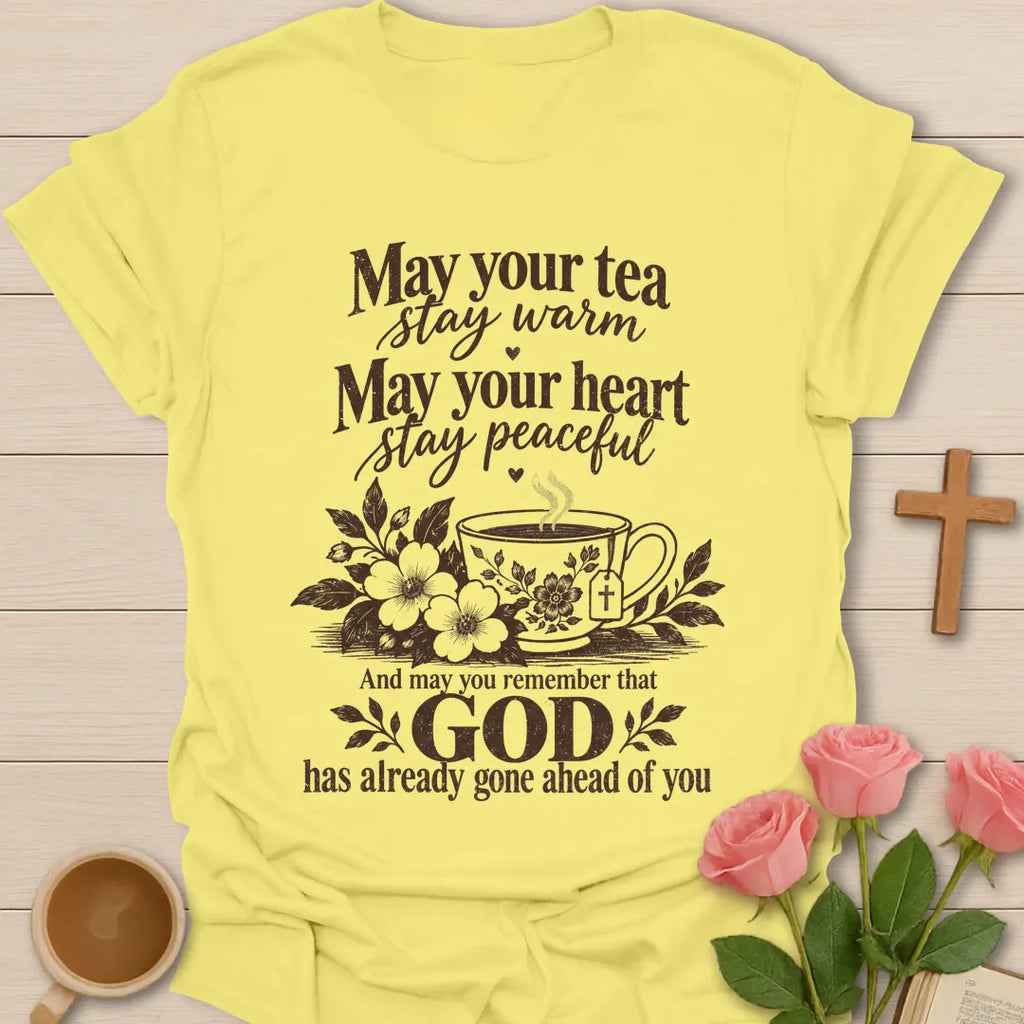 May Your Tea Stay Warm, May Your Heart Stay Peaceful, God Has Already Gone Ahead Of You t-shirt with a floral teacup marked with a cross - Cornsilk