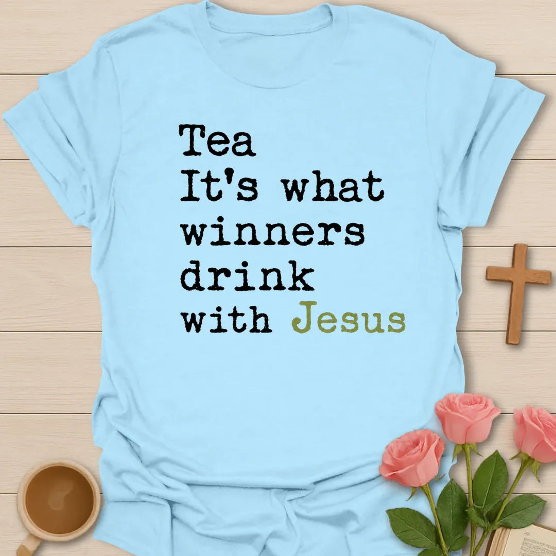 What Winners Drink With Jesus shirt with teacup, cross, and bold vintage lettering. - Light Blue